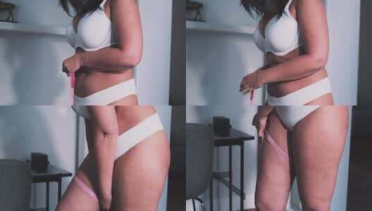 女人在测量腰围高清在线视频素材下载