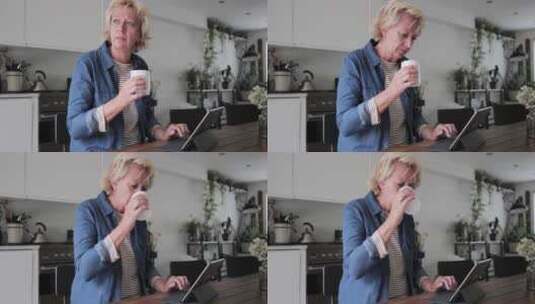 女人一边喝咖啡一边工作高清在线视频素材下载