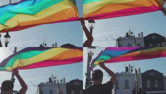 两名男子高举彩虹旗高清在线视频素材下载