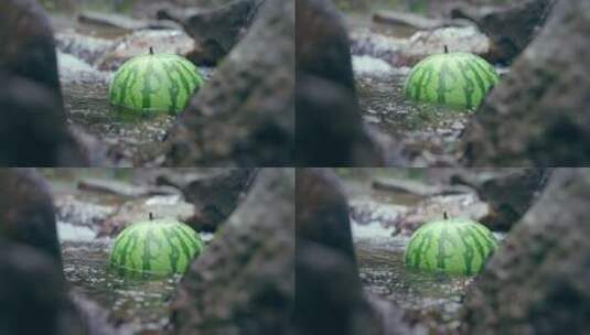 4K实拍夏天西瓜漂浮在清澈冰凉的溪水高清在线视频素材下载