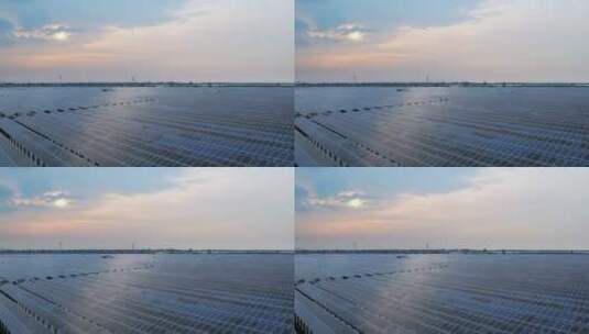 农田上的光伏太阳能发电夕阳下航拍高清在线视频素材下载