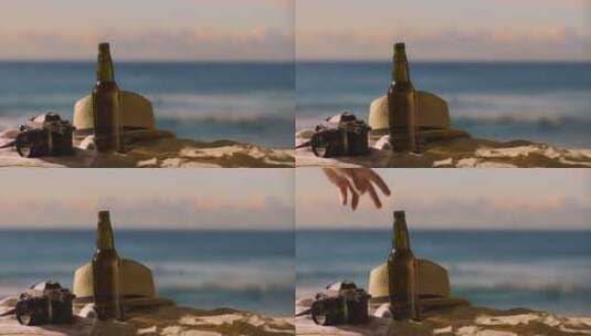 海滩上的啤酒瓶相机特写镜头高清在线视频素材下载
