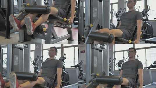 男子在健身房进行腿部肌肉锻炼高清在线视频素材下载