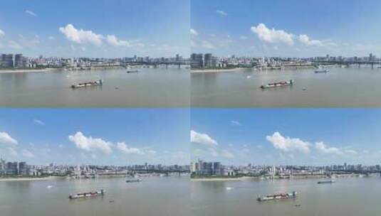 航拍武汉城市长江上行驶的物流货轮高清在线视频素材下载