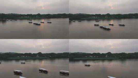 杭州西湖日出时分 泛舟湖上 摇橹船高清在线视频素材下载