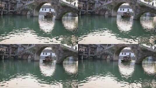 （慢镜头）江南水乡乌镇乌篷船河中前行高清在线视频素材下载