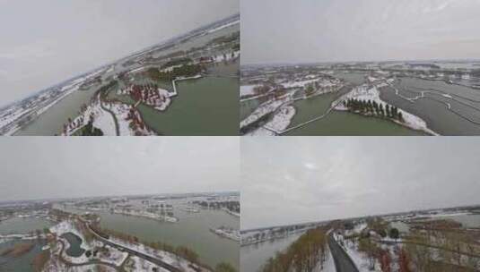 穿越机航拍北湖湿地公园雪景下雪高清在线视频素材下载