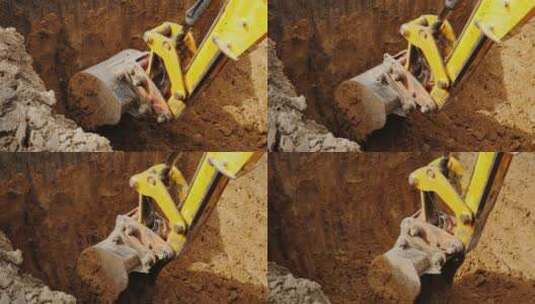 挖掘机铲斗在挖坑高清在线视频素材下载