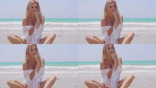 美女坐在沙滩拍照高清在线视频素材下载