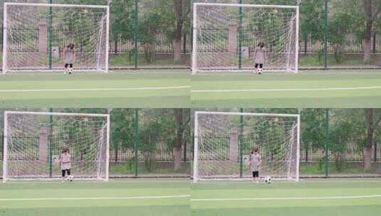 在足球场踢球的中国女童高清在线视频素材下载