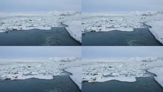 在冰岛飞越一条满是大冰的河流高清在线视频素材下载