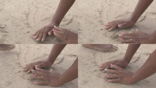 女人在沙滩上玩沙子的特写镜头高清在线视频素材下载