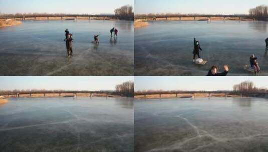 航拍冬季在结冰的河流冰面上滑冰玩耍的游人高清在线视频素材下载