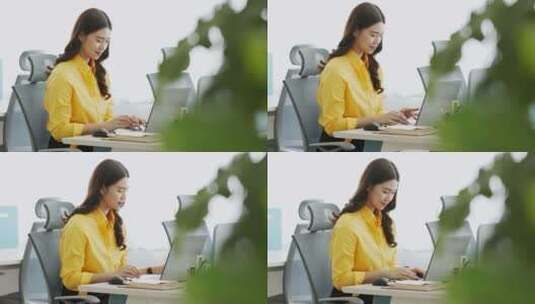 穿着黄色衬衫喝咖啡的亚洲女人用电脑笔记本电脑思考得到想法高清在线视频素材下载