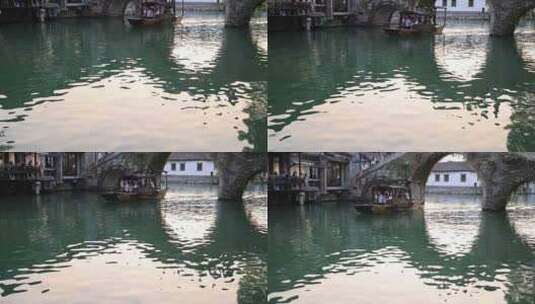 江南水乡乌镇乌篷船河中前行4k升格慢镜头高清在线视频素材下载