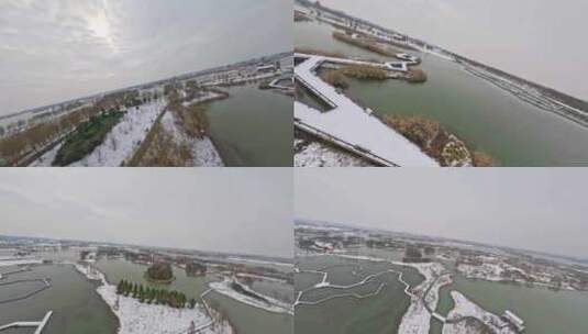 穿越机航拍北湖湿地公园雪景下雪高清在线视频素材下载