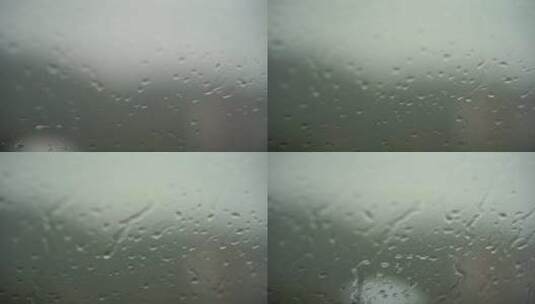 雨滴滴落在窗户上雨天窗户车窗下雨天雨水高清在线视频素材下载