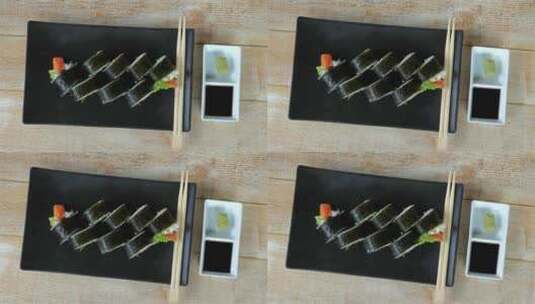 精美的寿司盘放在木制桌子上，非常适合食物高清在线视频素材下载