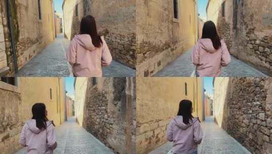 西班牙走在欧洲街上的年轻女子旅游概念高清在线视频素材下载