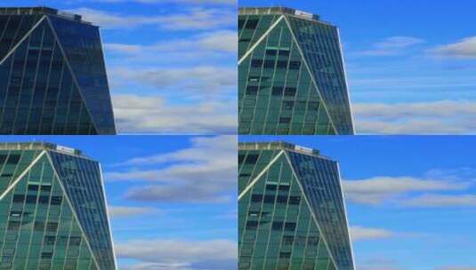 蓝天下玻璃建筑上的云景反射高清在线视频素材下载