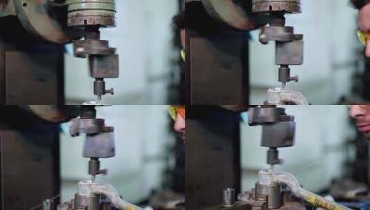工人在工厂的机器上钻孔高清在线视频素材下载