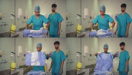 医护人员展开手术服高清在线视频素材下载