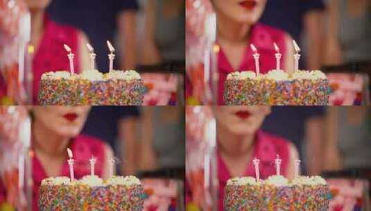 蛋糕上的蜡烛正被名人熄灭高清在线视频素材下载