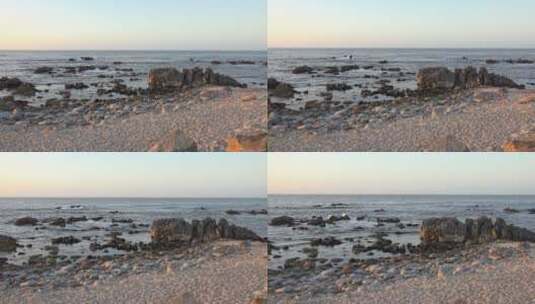 蓝天下的海滩石头高清在线视频素材下载