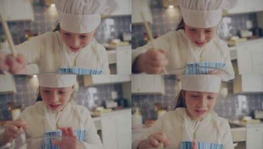 下女孩在小女孩在厨房和面的特写镜头高清在线视频素材下载
