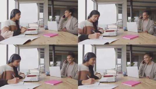 专注于混血女性在家使用笔记本电脑和智能手机工作的视频高清在线视频素材下载
