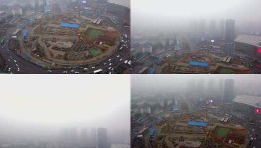 俯拍建设中的武汉光谷广场圆盘转盘大雾高清在线视频素材下载