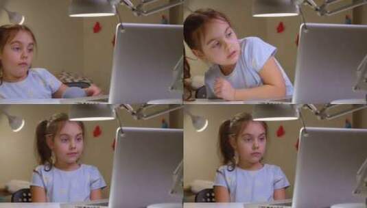 女孩看着她的笔记本电脑高清在线视频素材下载