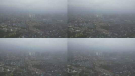 雨季迷雾中的城市航拍高清在线视频素材下载