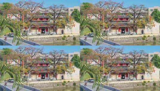 河边古建筑及盛开的红花树高清在线视频素材下载