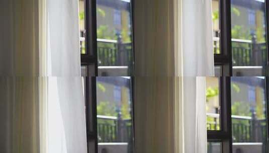 风吹窗帘窗户白色窗帘飘动阳光透过白色窗帘高清在线视频素材下载