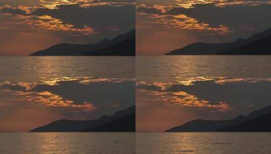 宁静的海岸线上令人惊叹的日落高清在线视频素材下载