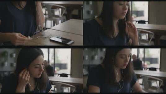 女人在咖啡馆里带上耳机听音乐高清在线视频素材下载