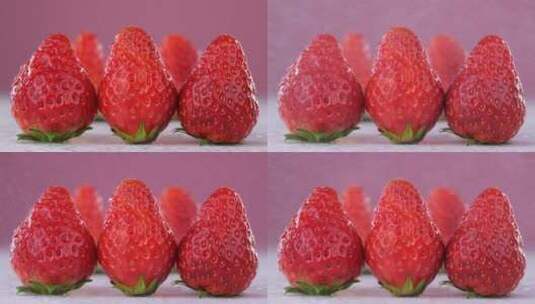 三颗草莓上喷水镜头高清在线视频素材下载
