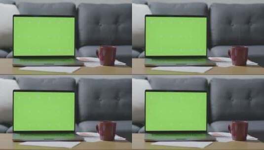 桌子上的绿屏笔记本电脑高清在线视频素材下载