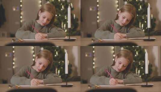 小女孩趴在圣诞树前写信高清在线视频素材下载