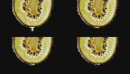 水果猕猴桃切片滴汁水的慢镜头特写高清在线视频素材下载