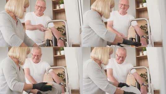 一对老年夫妇在厨房里洗碗高清在线视频素材下载