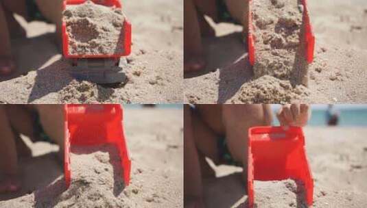 玩具车的特写，沙子落下。一个孩子在沙滩上玩塑料车高清在线视频素材下载