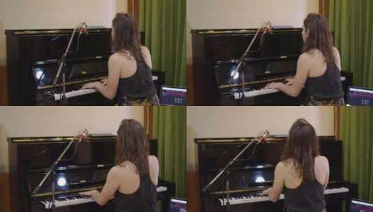 从后面看一个弹钢琴的西方女人高清在线视频素材下载