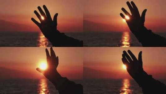 指缝间的余晖夕阳下的手掌轮廓高清在线视频素材下载