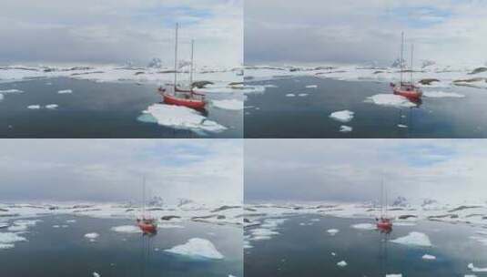 南极帆船旅行冰山海洋鸟瞰红船探索南极海岸高清在线视频素材下载