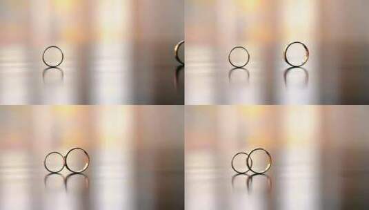 结婚戒指在桌子上滚动特写镜头高清在线视频素材下载