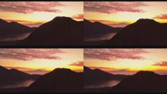 航拍山的剪影与日落的场景高清在线视频素材下载