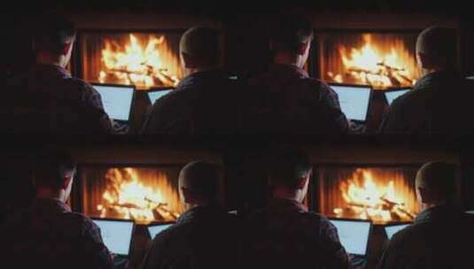 男人在壁炉旁使用电脑办公高清在线视频素材下载