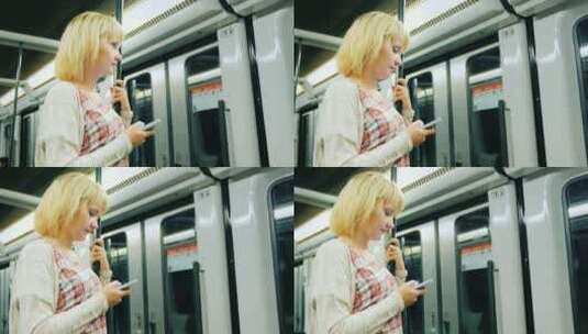 在地铁车厢玩手机的女人高清在线视频素材下载